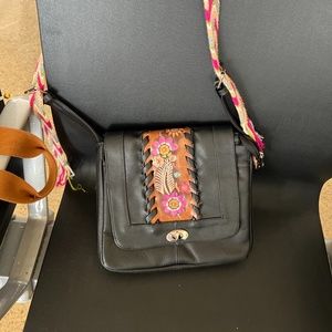 Leather over the shoulder bag with flower print